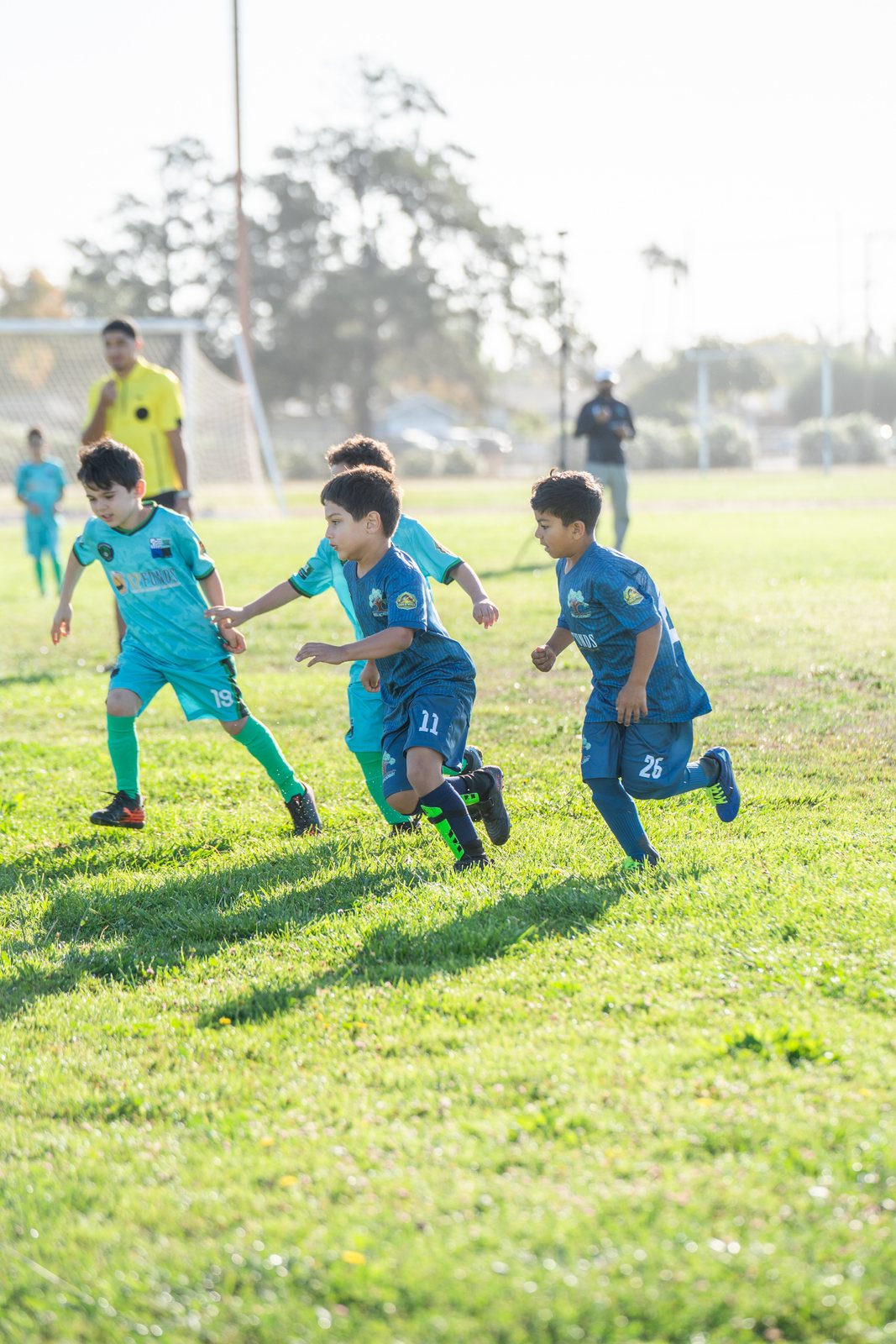 Three players breaking forward together with the ball